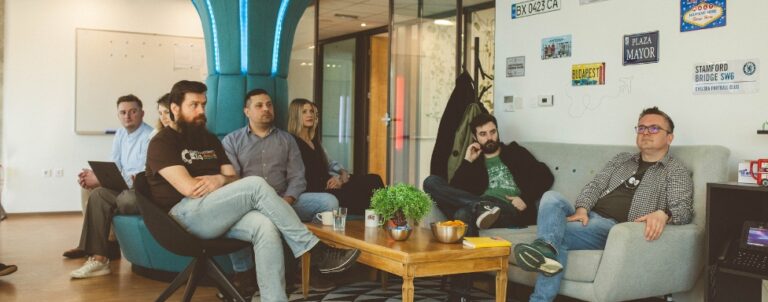 Employees listening to a presentation at the meeting